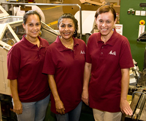 three woman in a manufactory showing three woman in a manufactory