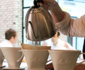 Showing coffee cup and pour over Showing coffee cup and pour over