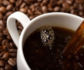 Showing coffee beans and coffee cup